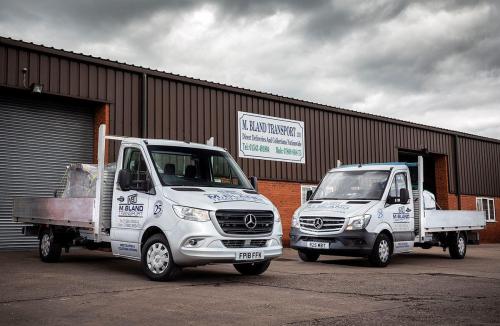 A Fleet of Small Flat Bed Lorries